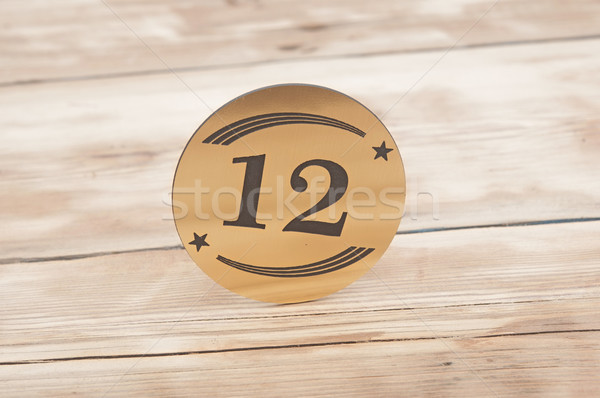 Hotel suite key with room number 12 on wood table  Stock photo © inxti