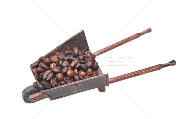 Miniatura modelo carrinho de mão grãos de café branco madeira Foto stock © inxti