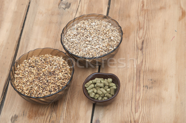 beer ingredients, hops and malt on wooden table top Stock photo © inxti