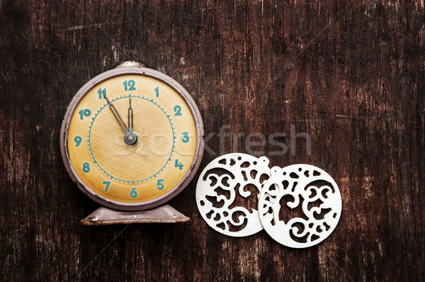 Vintage background with retro alarm clock on table Stock photo © inxti