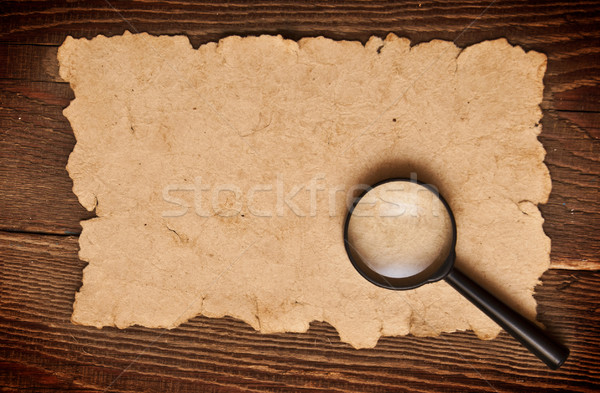 magnifying glass on old paper Stock photo © inxti