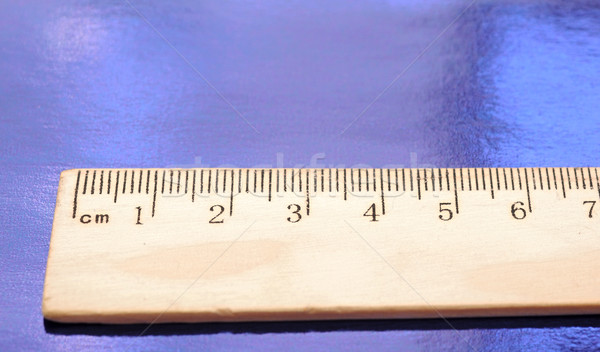 A wood ruler on blue background Stock photo © inxti
