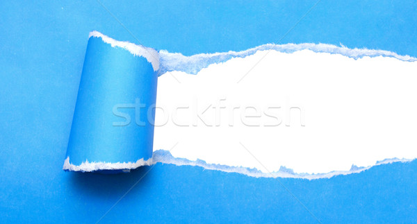 Stock photo: white background visible through the blue paper wrapped 