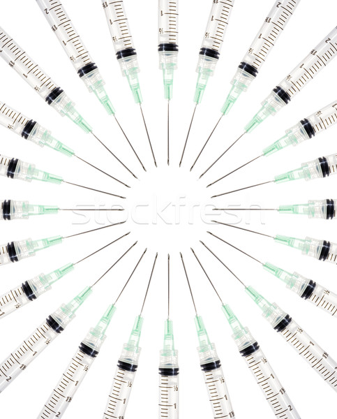 Syringes in a circle Stock photo © iodrakon