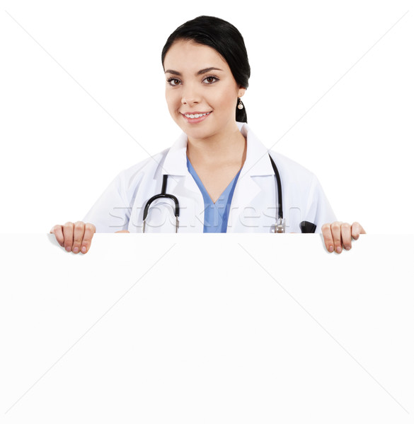 Female doctor holding blank sign Stock photo © iodrakon