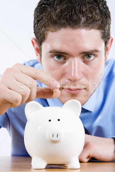 Poupança estoque imagem homem moeda piggy bank Foto stock © iodrakon