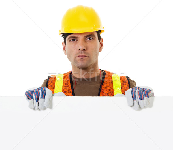 Construction worker holding blank sign Stock photo © iodrakon