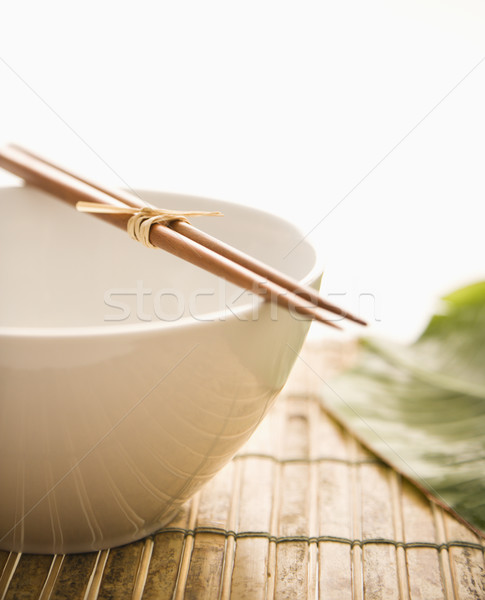 Eetstokjes lege kom geïsoleerd bamboe groen blad Stockfoto © iofoto