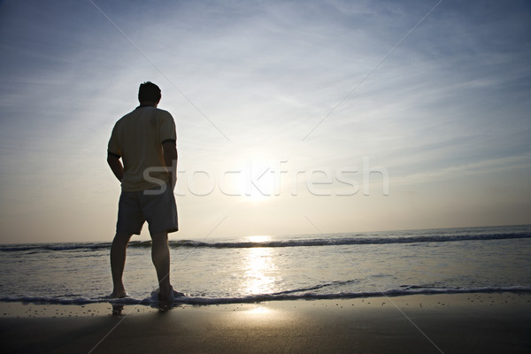 Homme seuls plage permanent regarder [[stock_photo]] © iofoto