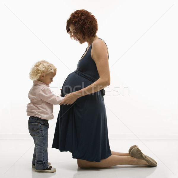 Daughter and pregnant mother. Stock photo © iofoto