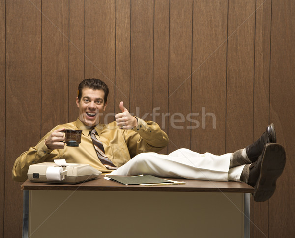 Hombre retro empresario sesión pies Foto stock © iofoto