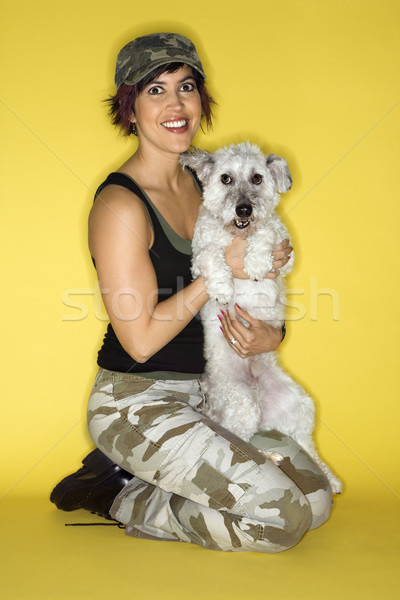 Pretty young woman holding dog. Stock photo © iofoto