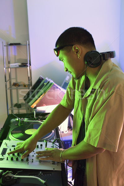 Male DJ playing music. Stock photo © iofoto
