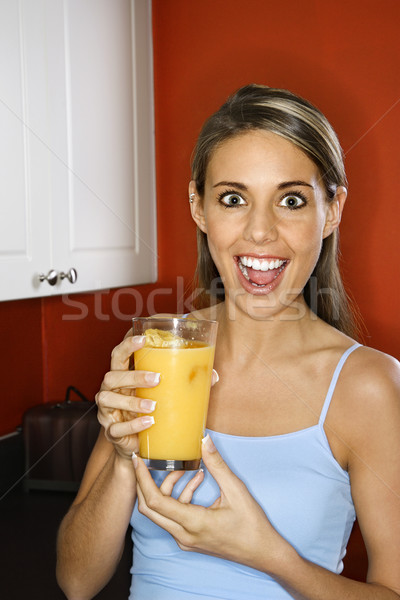 Woman with juice glass. Stock photo © iofoto