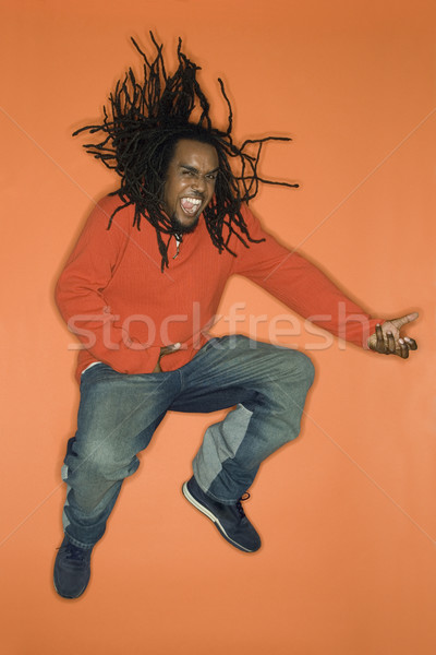 Man jumping with enthusiasm. Stock photo © iofoto