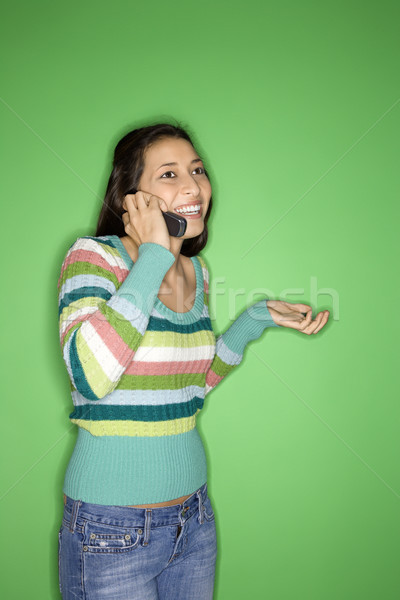 Girl talking on cellphone. Stock photo © iofoto