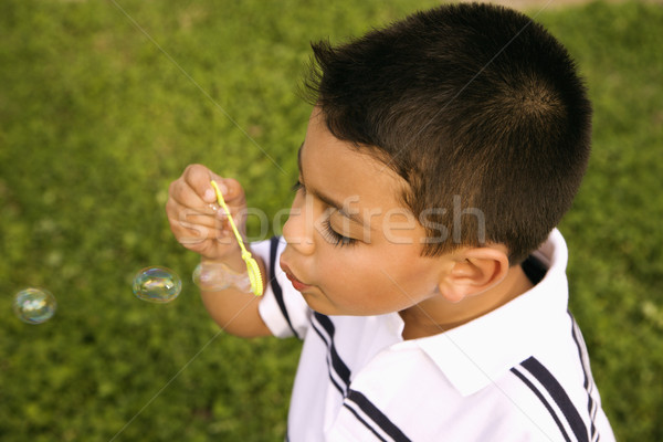 Young Boy Blowing Bubbles Stock photo © iofoto