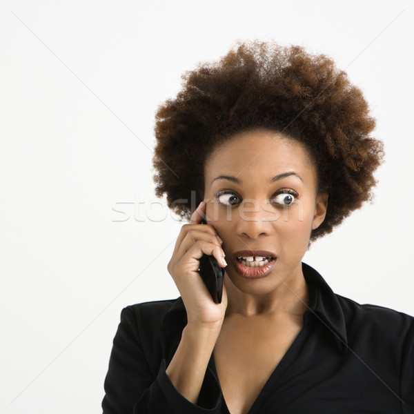 Nő hírek beszél mobiltelefon néz megrémült Stock fotó © iofoto