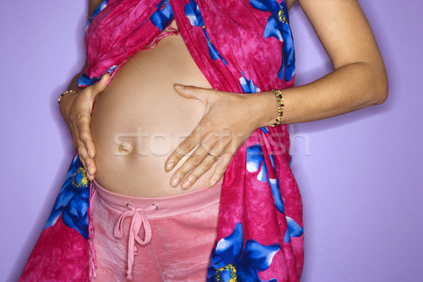 Terhes nő mutat gyomor közelkép portré női Stock fotó © iofoto