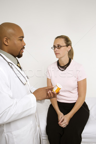 Doctor explaining medication. Stock photo © iofoto