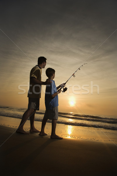 Człowiek młody chłopak połowów surfowania syn ojca ocean Zdjęcia stock © iofoto