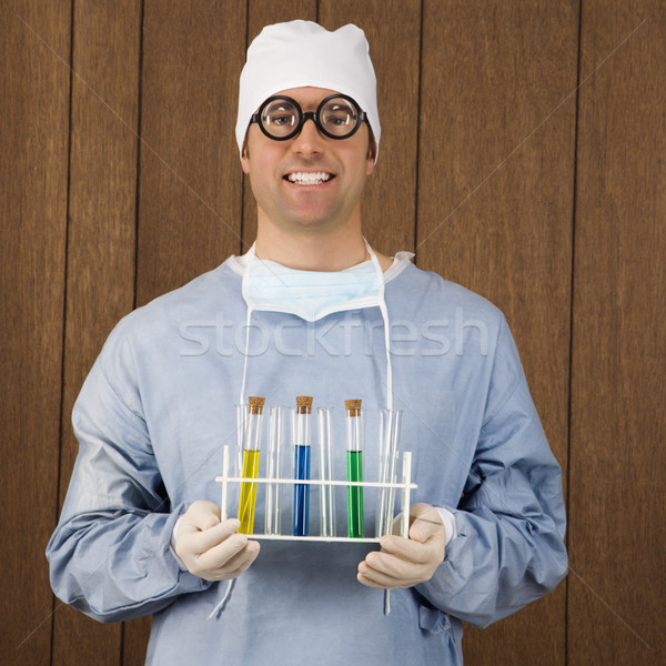 Surgeon holding test tubes. Stock photo © iofoto