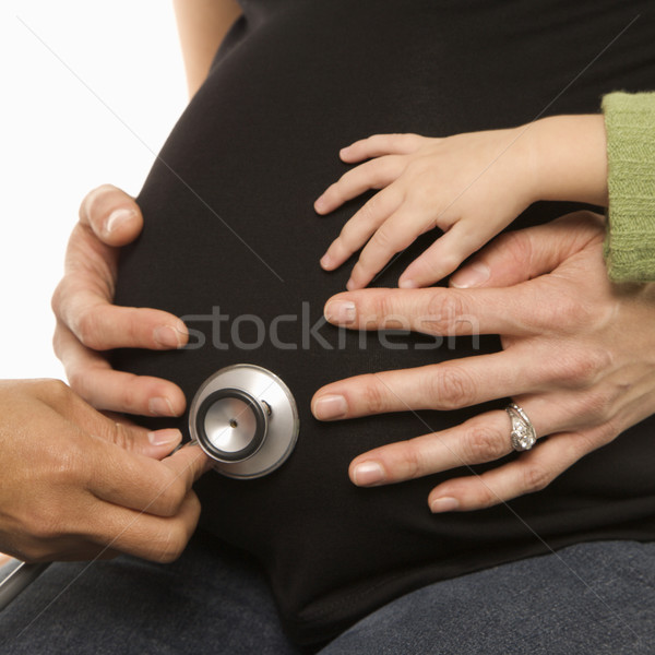 Estetoscópio grávida barriga enfermeira caucasiano Foto stock © iofoto