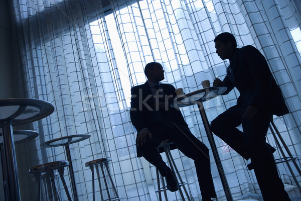 Imprenditori caffè view silhouette asian seduta Foto d'archivio © iofoto