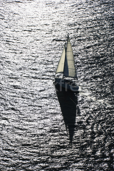 Backlit sailboat. Stock photo © iofoto