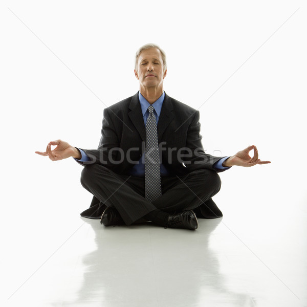 Om de afaceri yoga caucazian varsta mijlocie meditativ lotus Imagine de stoc © iofoto