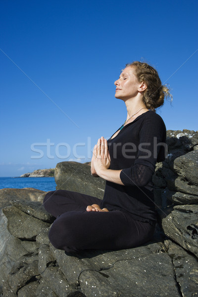 Woman practicing yoga. Stock photo © iofoto