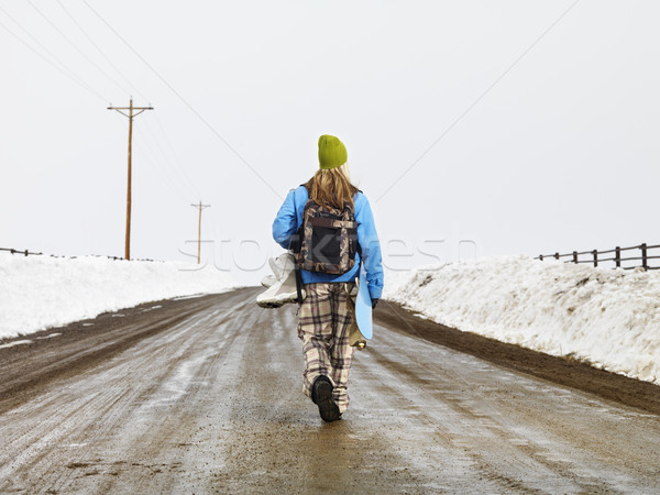 Stock photo: Woman with snowboard.