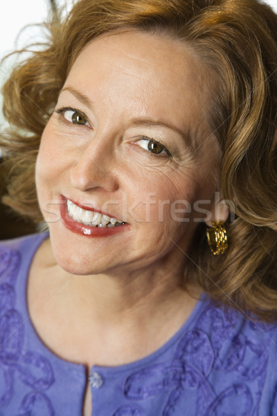 Smiling woman portrait. Stock photo © iofoto