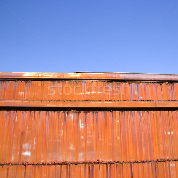 Rusted orange metal and sky. Stock photo © iofoto
