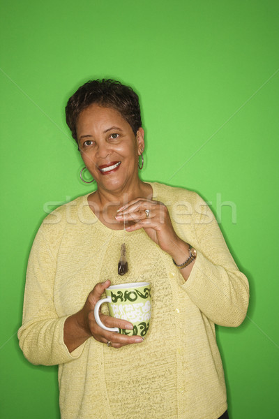 Nő készít forró tea afroamerikai női Stock fotó © iofoto