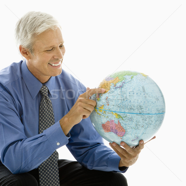 Businessman with globe. Stock photo © iofoto