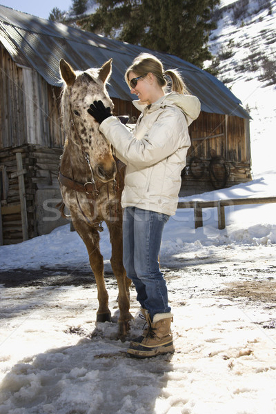 женщину лошади кавказский стабильный зима Сток-фото © iofoto