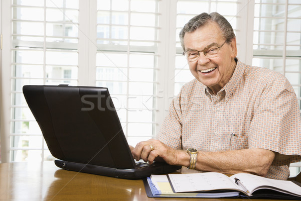 Mature man with laptop. Stock photo © iofoto