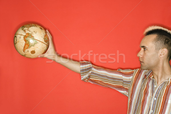 Man holding world globe. Stock photo © iofoto