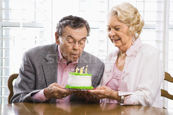 Mature couple with cake. Stock photo © iofoto