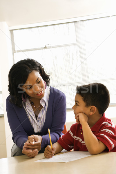 Teacher Helping Boy With Schoolwork  Stock photo © iofoto
