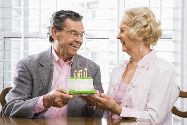 Mature couple with cake. Stock photo © iofoto