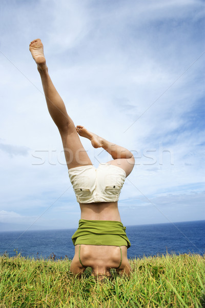 Woman doing headstand. Stock photo © iofoto