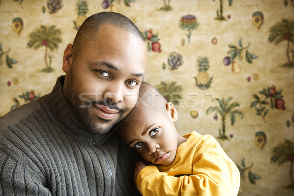 Vater lächelnd halten jungen Sohn Porträt Stock foto © iofoto