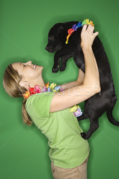Nő tart fekete kutyakölyök kaukázusi felnőtt Stock fotó © iofoto
