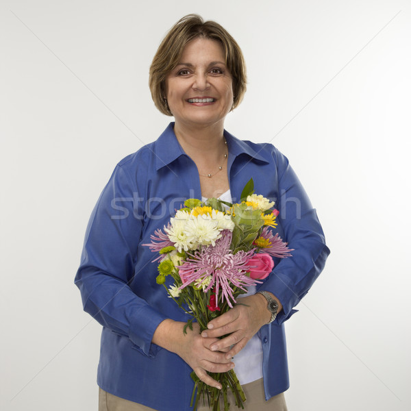 Woman holding bouquet. Stock photo © iofoto