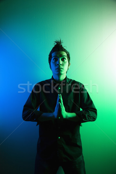 Young attractive man meditating. Stock photo © iofoto