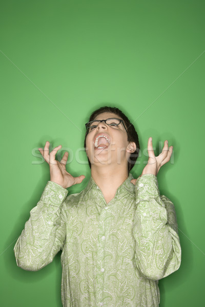 Caucasian teen boy screaming. Stock photo © iofoto