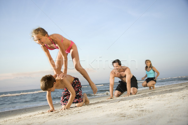 Stock fotó: Család · tengerpart · játszik · szökkenés · béka · vízszintes