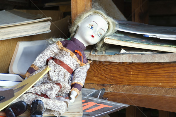 Old abandoned doll on shelf Stock photo © iofoto